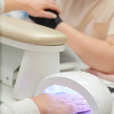 The manicure lamp on the table.